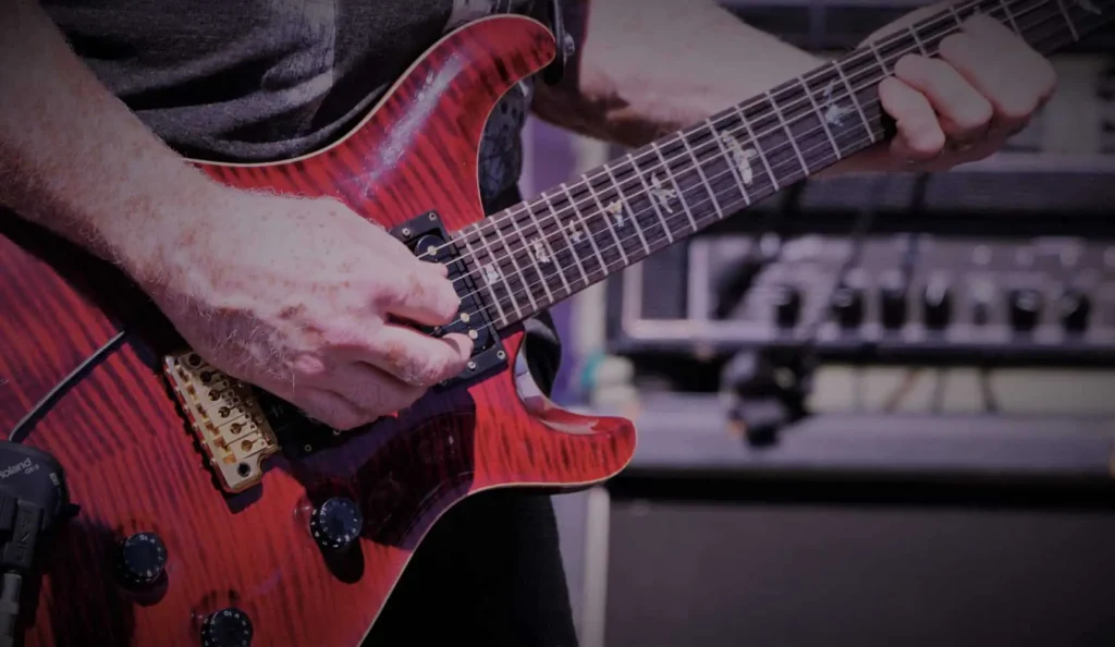 Guitarist playing the best metal guitar under 500