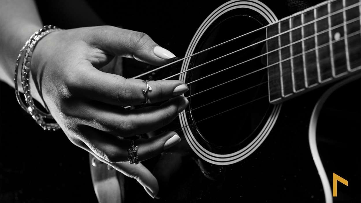 image showing guitarist learning easy guitar songs