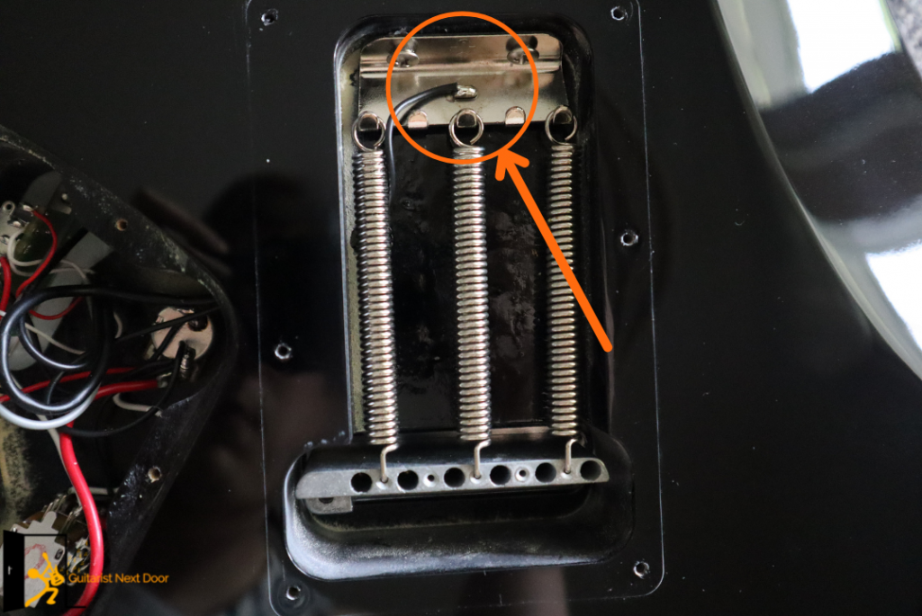 image reveals where you can usually find Guitar Grounding wire