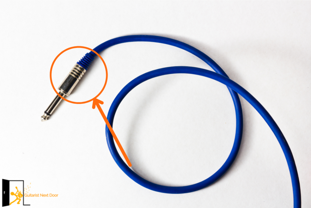 Image points out where inside the guitar cable the issue for buzzing can be