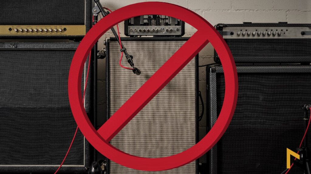 Photo shows readers an guitar amp and microphone