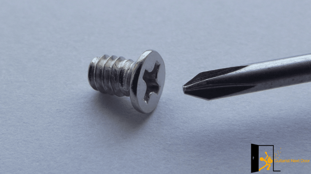 Displays a screw and screwdriver