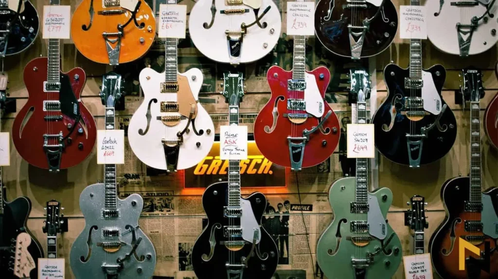 Photo shows hollow-body guitars to the readers