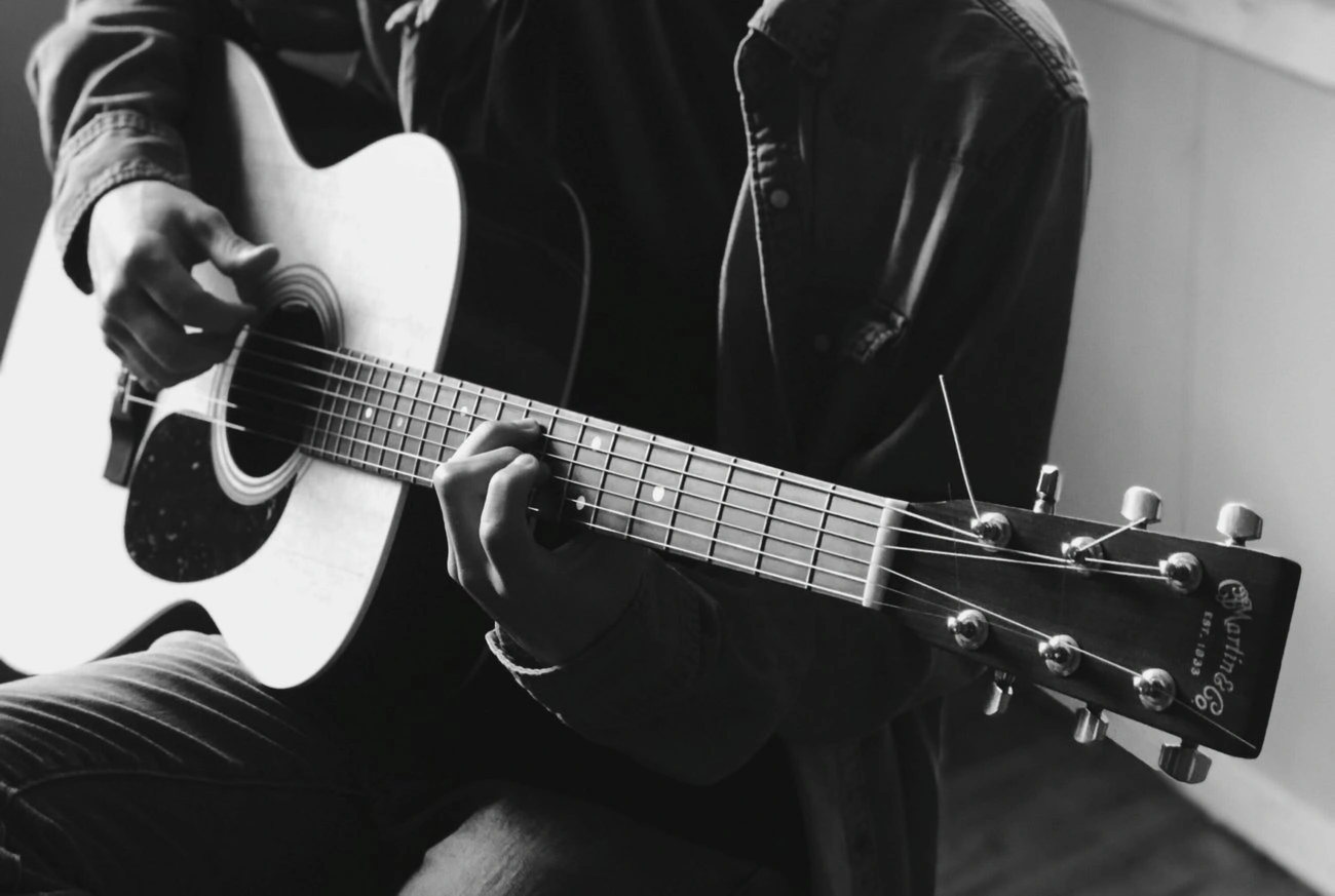 displays an acoustic guitar made by Martin guitars