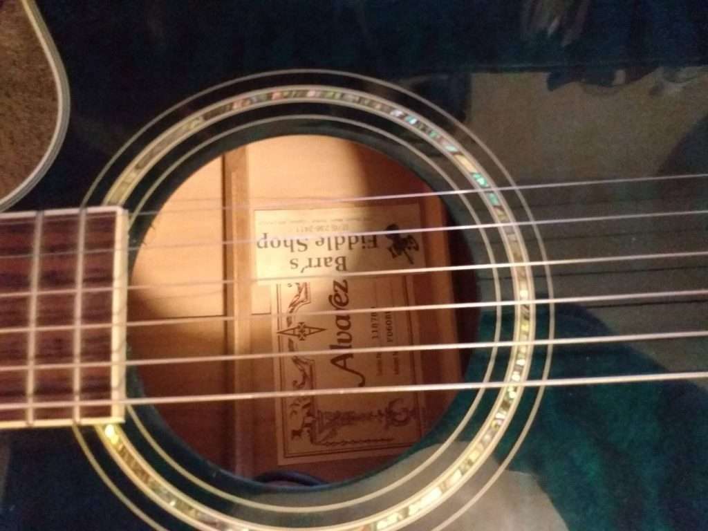 photo reveals acoustic guitar sound hole