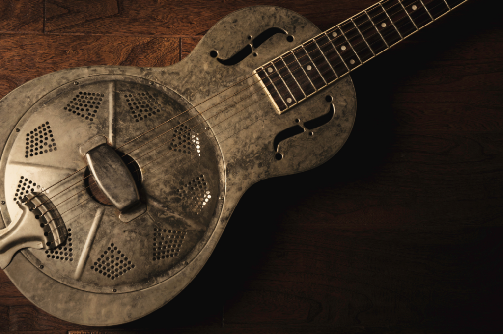 image displays resonator acoustic guitar with metal body