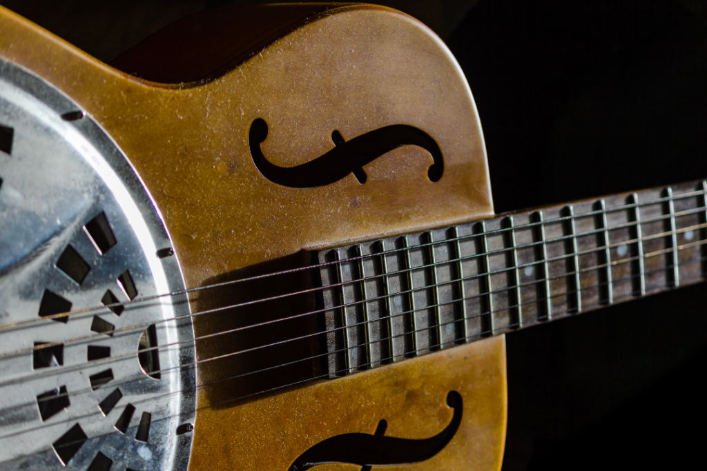 image displays resonator acoustic guitar with wooden body