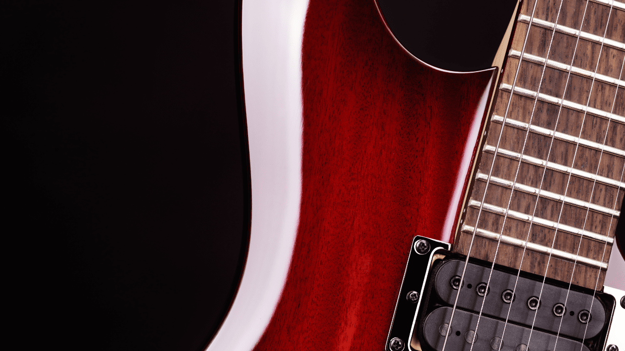 displays a Guitar With Extra Jumbo Frets