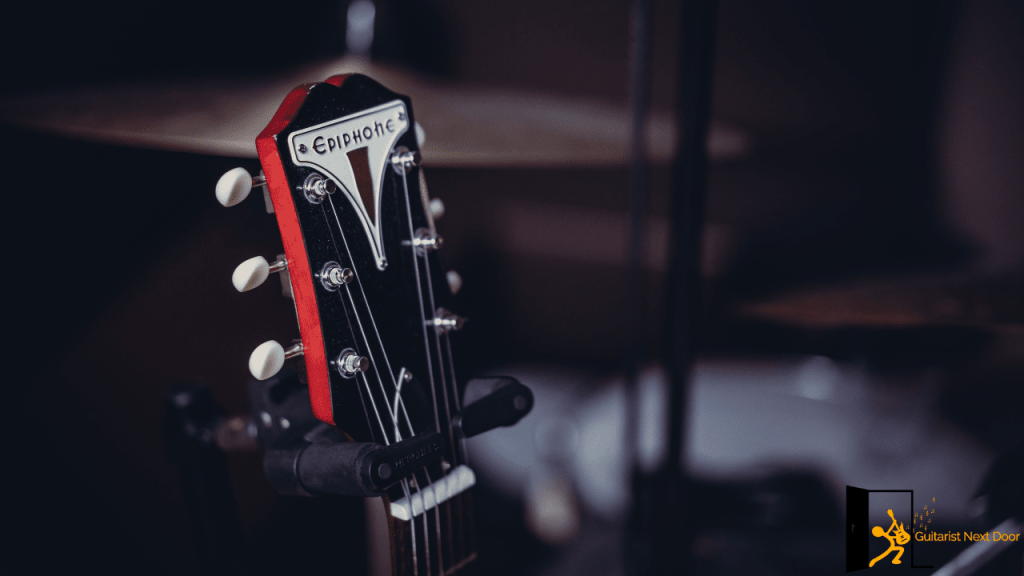 displays headstock of an Epiphone Acoustic Guitar