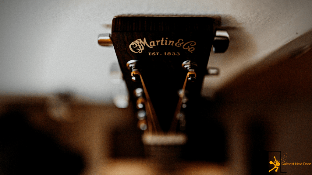 Displays a headstock of a Martin guitar