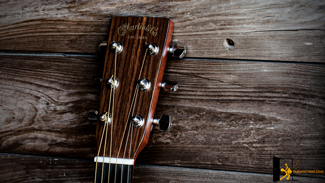 Displays a headstock of a Martin guitar