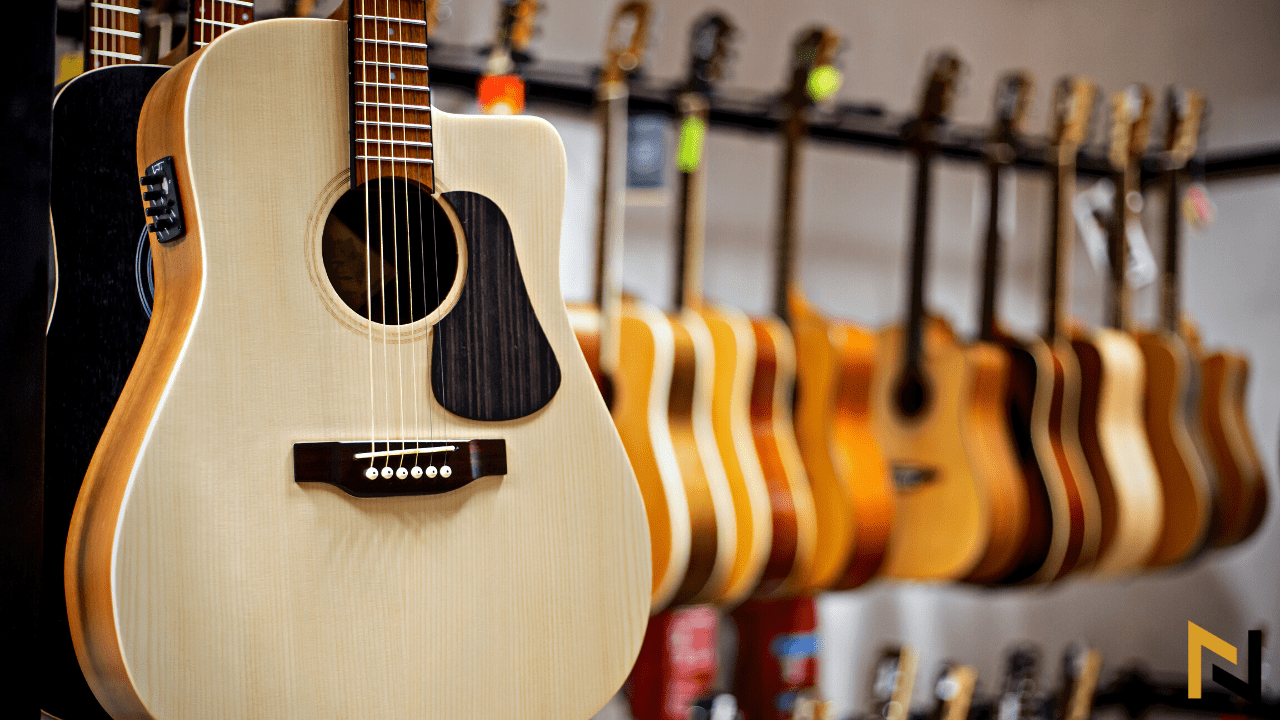 Displays Acoustic Guitars With Built-In Tuners