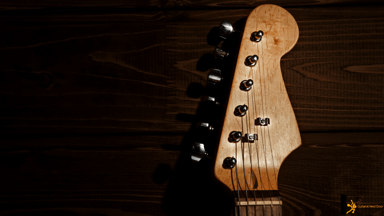 Displays headstock, nut, and neck of the guitar