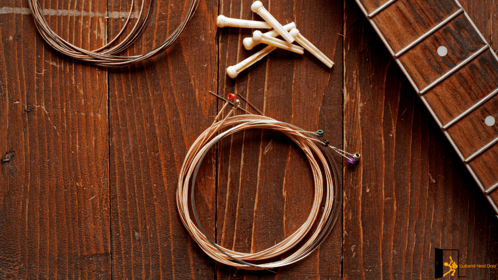 displays acoustic guitar strings and bridge pins