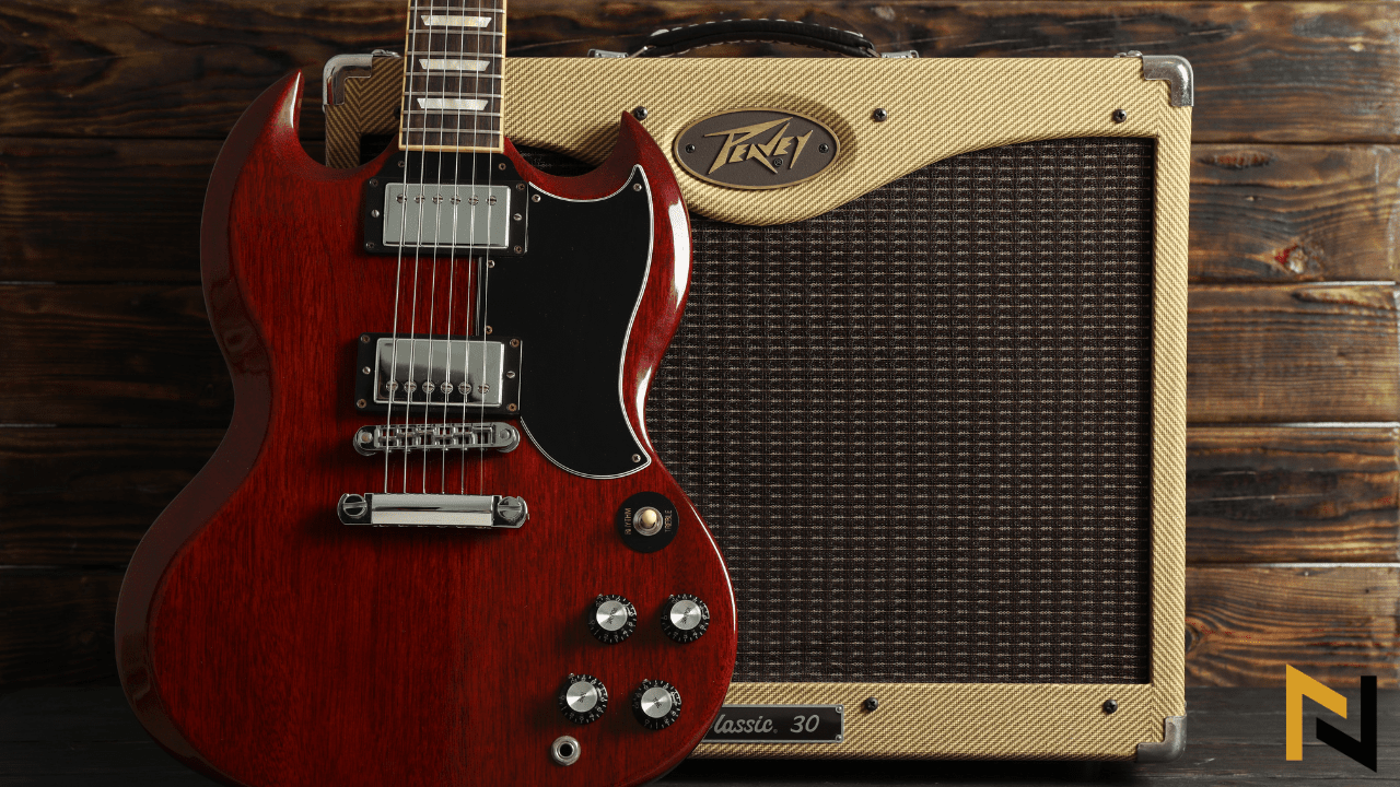 displays a guitar amplifier and a guitar