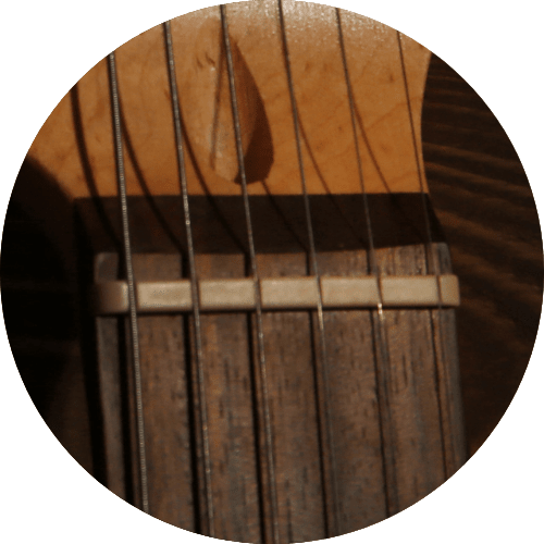 displays a Nut of an Electric guitar