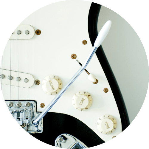 displays tremolo arm of an Electric guitar