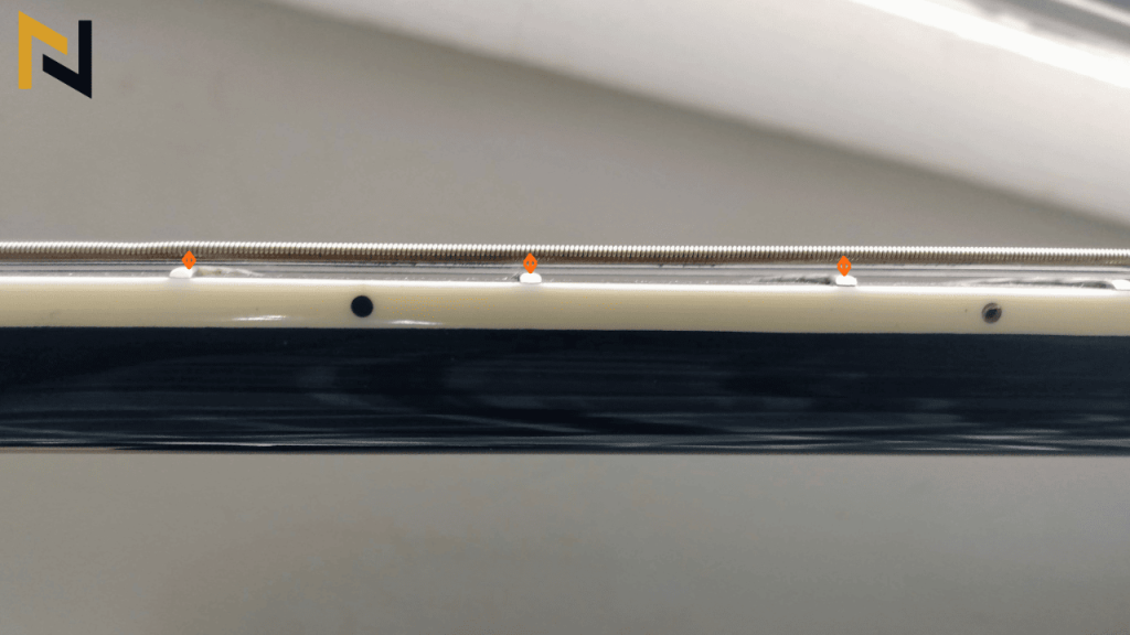 reveals what Guitar Action means