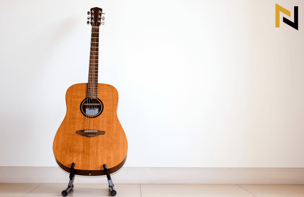 displays an acoustic guitar on a guitar stand