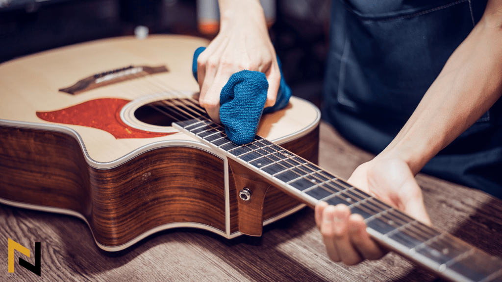 displays a guitar player cleaning a guitar