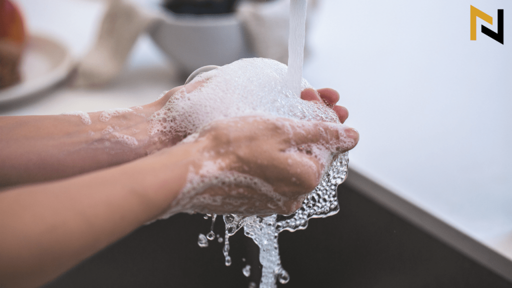 displays a guitar player Washing hands before guitar playing
