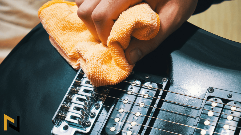 displays a guitar player Wiping The Guitar after playing