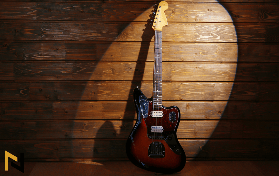 displays electric guitar on a spotlight