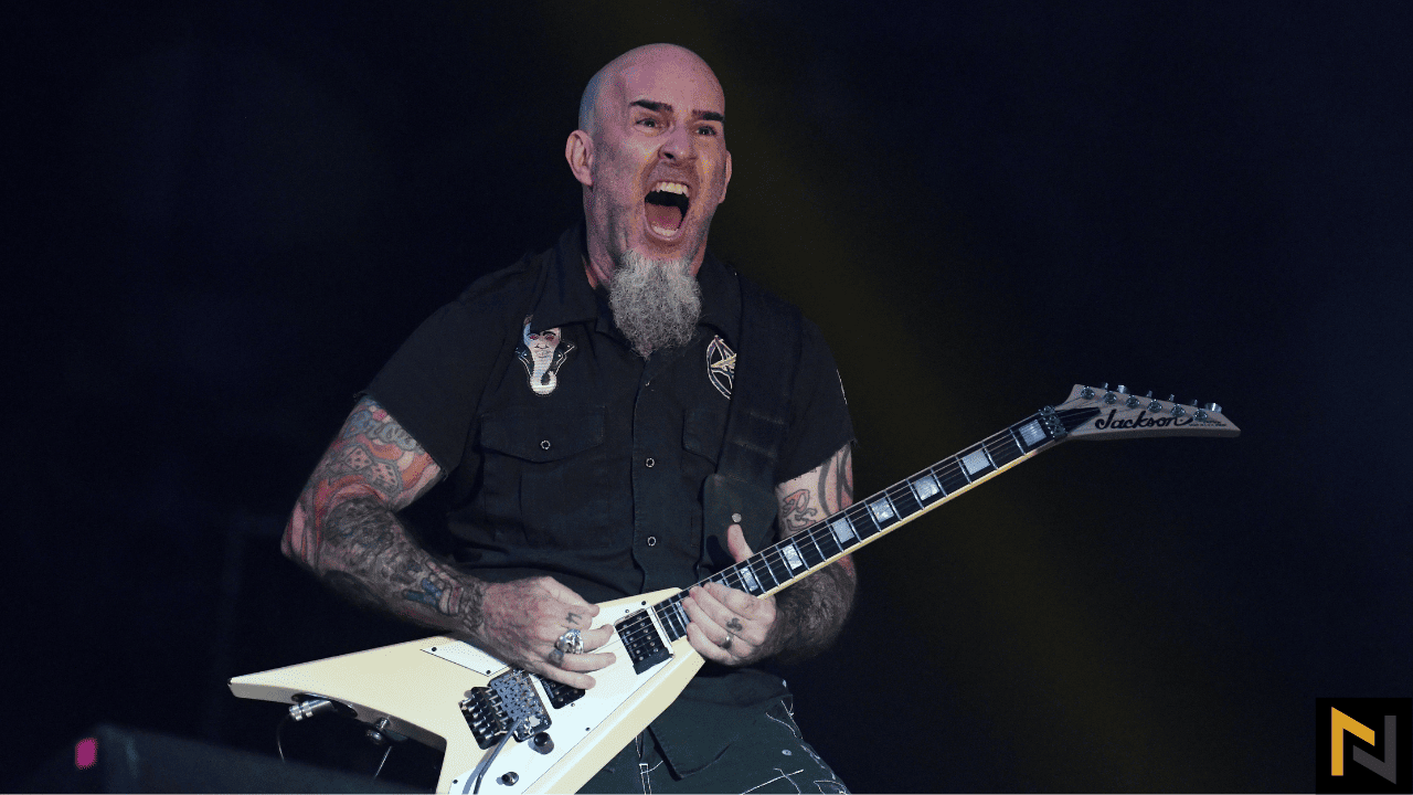 Displays Scott Ian Playing Jackson guitar