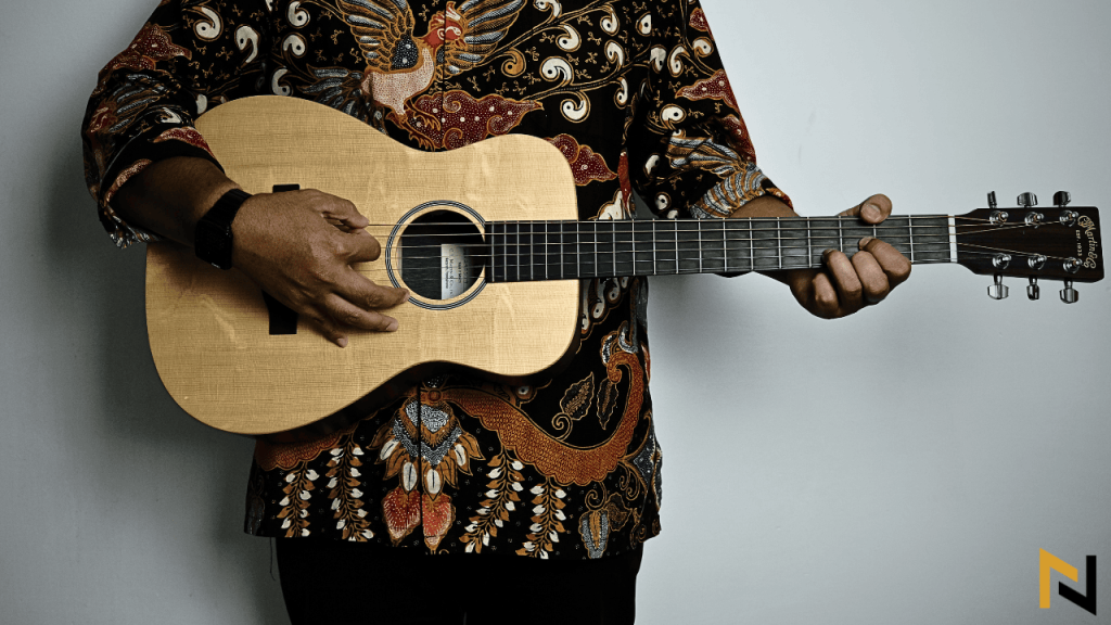 displays a little martin guitar