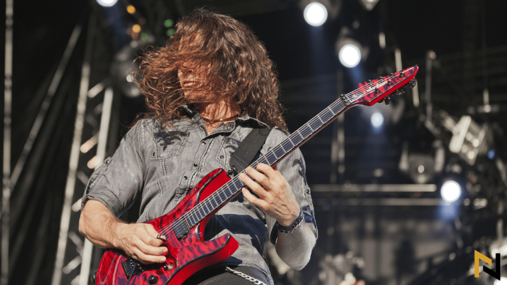 Displays Chris Broderick playing Jackson guitar