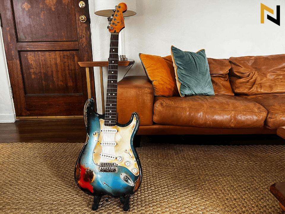Displays rugged Fender Stratocaster of the author Tyler Connaghan