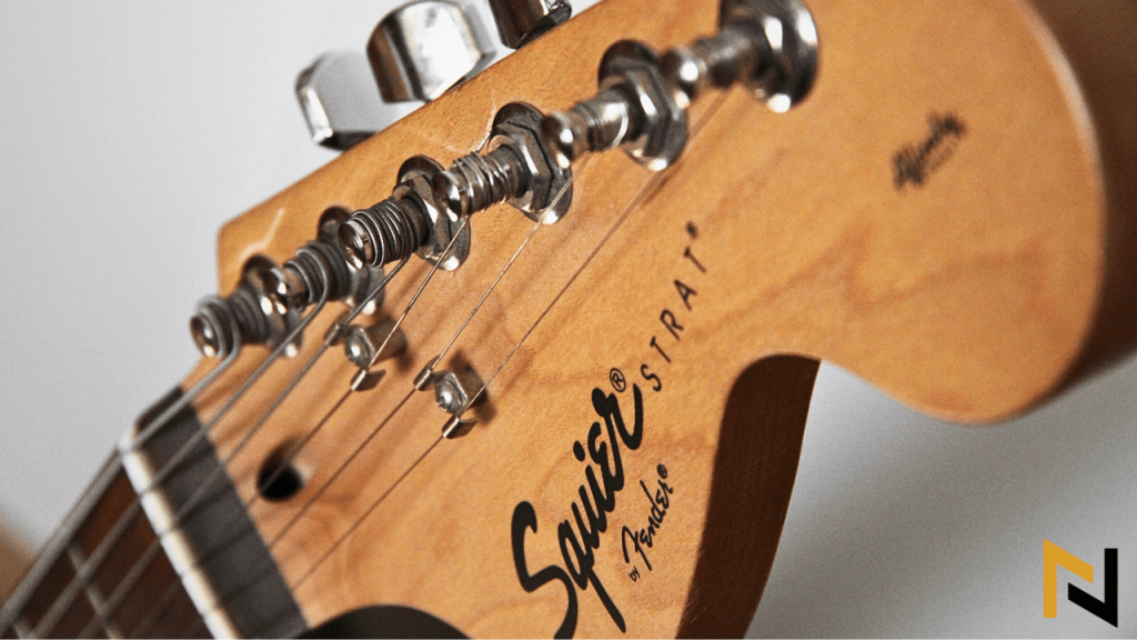image of squier guitar headstock with the question "are cheap guitars worth it"