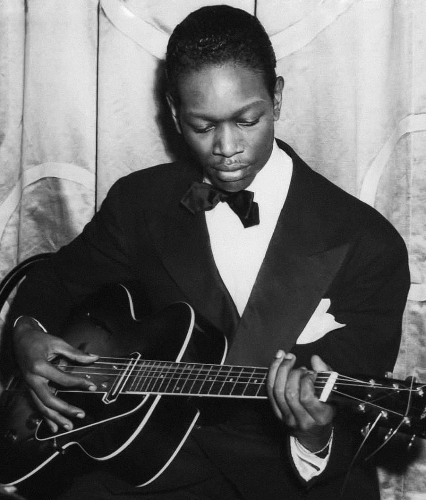 Charlie Christian playing guitar at the Waldorf Astoria, 1939