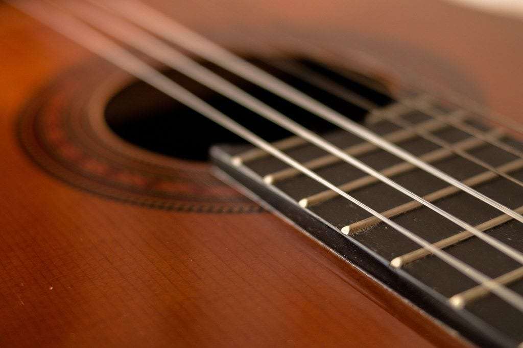 image showing halfwound acoustic guitar strings on an acoustic guitar