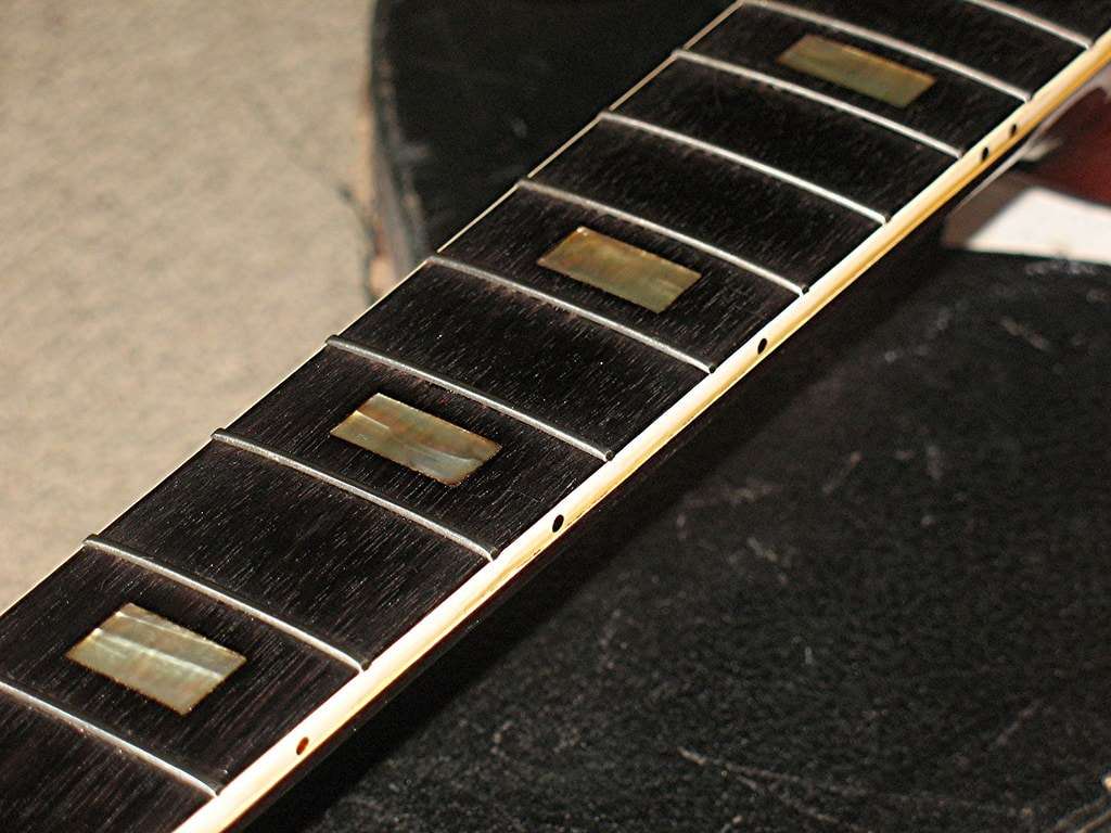 image shows Gibson neck after a re-fret to replace problematic fret wire