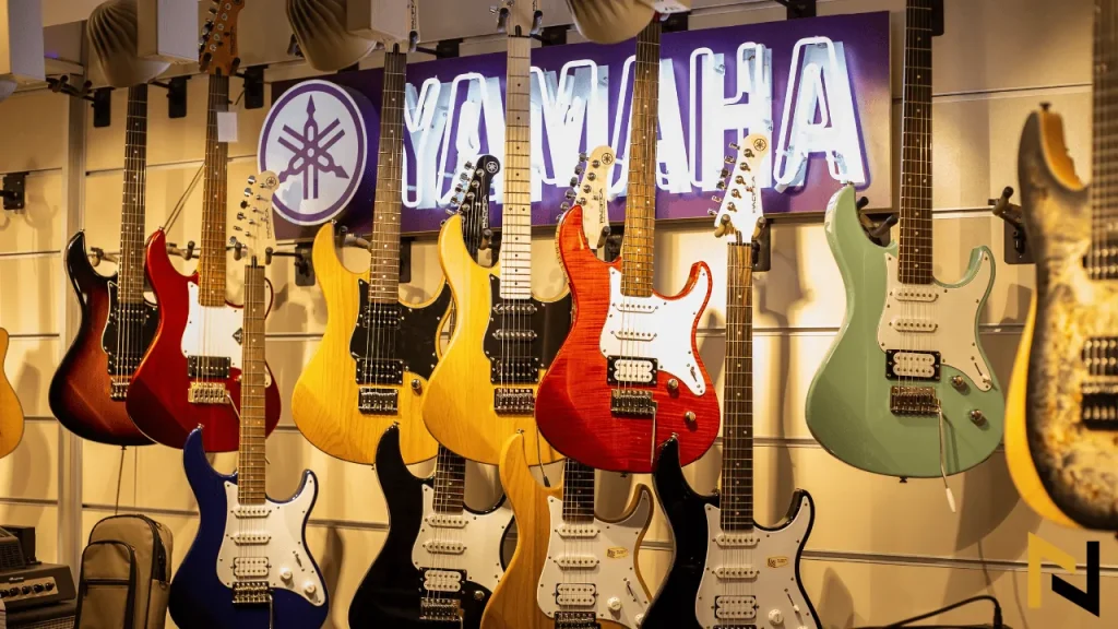 image shows yamaha pacifica electric guitars in shop with yamaha sign