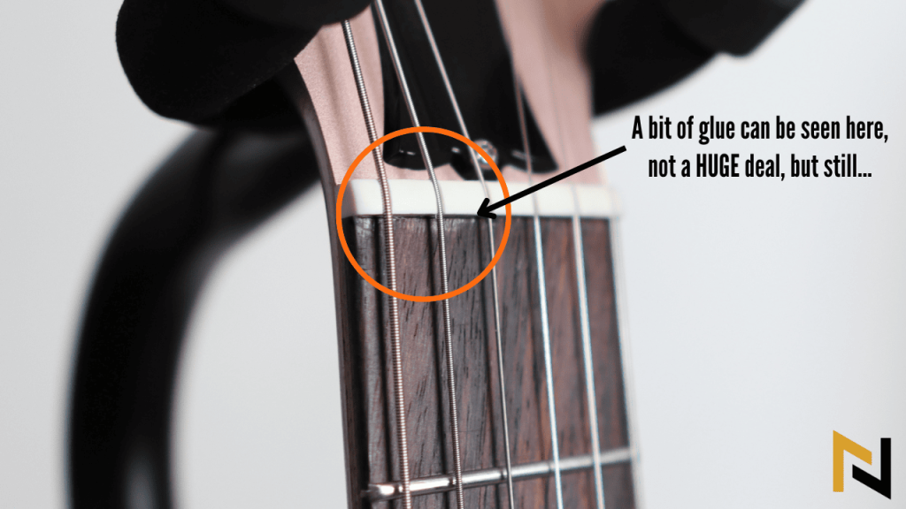 small amount of glue near the nut of gibson les paul modern lite