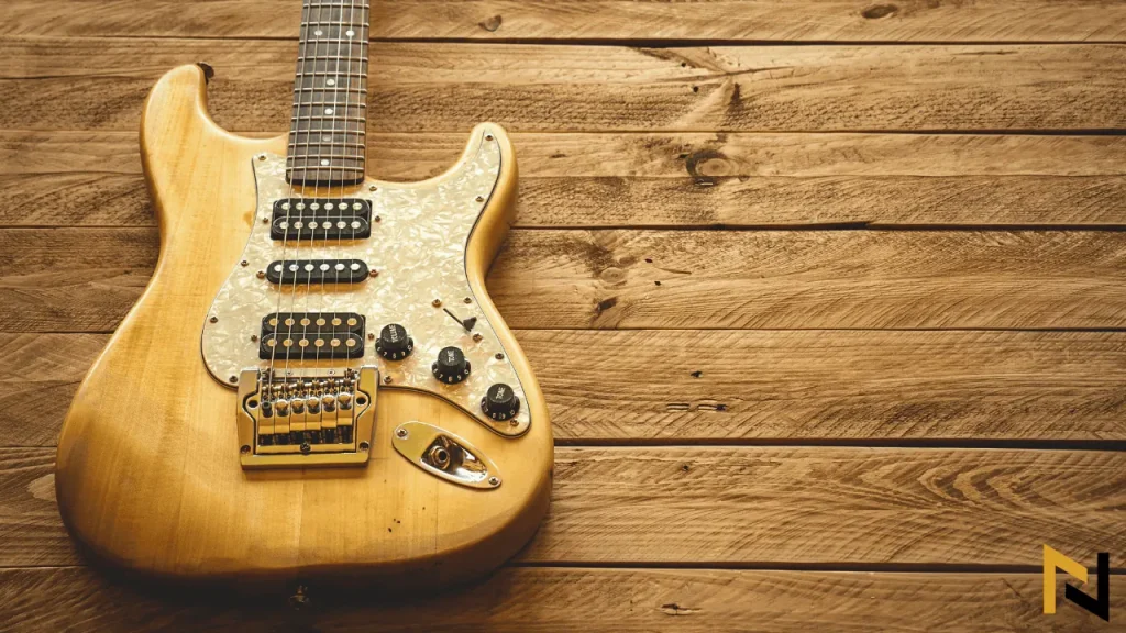 image shows a stratocaster with humbuckers on a wooden floor